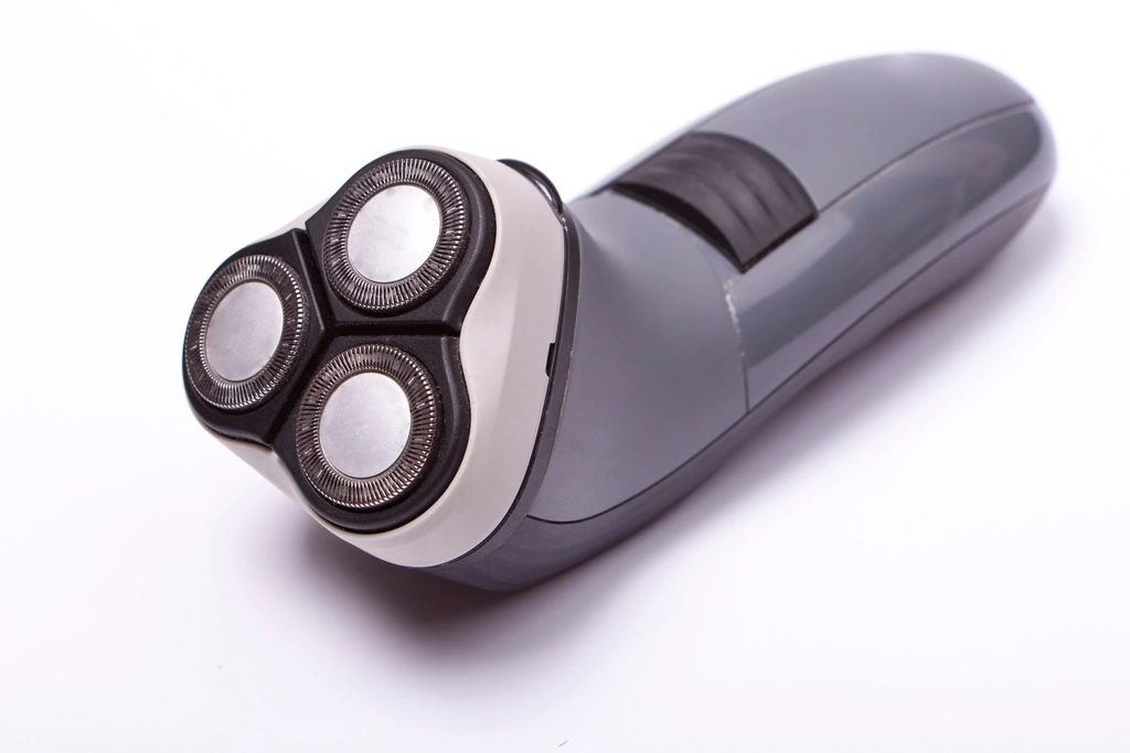 Close-up of an electric shaver head, used dry without shaving cream