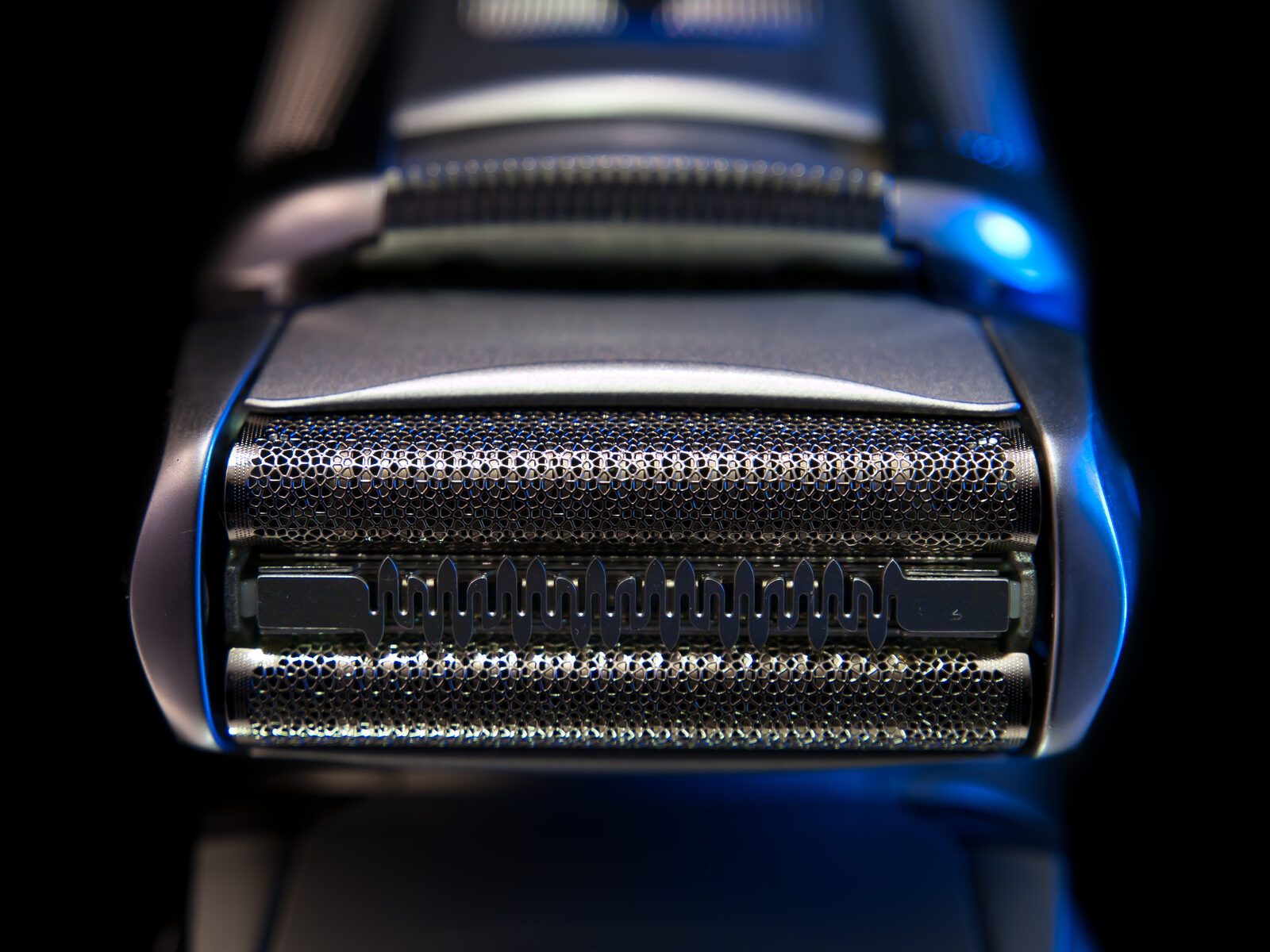Close-up of a foil electric head shaver head, the easiest tool to shave your head safely when you wear glasses