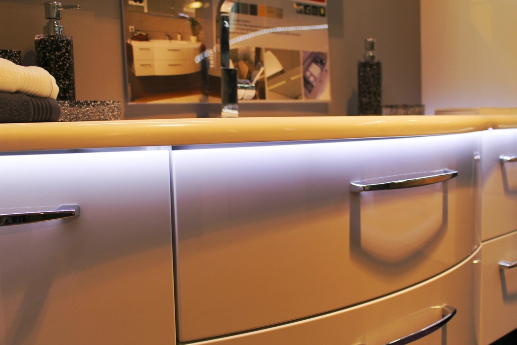 A tidy bathroom vanity with drawers and a mirror, a good dry place to store a head shaver